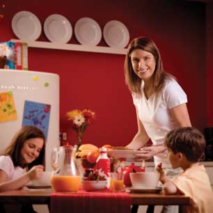 mother serving breakfast to children