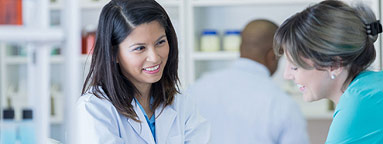 Lady and senior mother researching medicine online