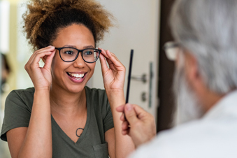 Woman trying on glasses