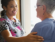 Nurse smiling at patient